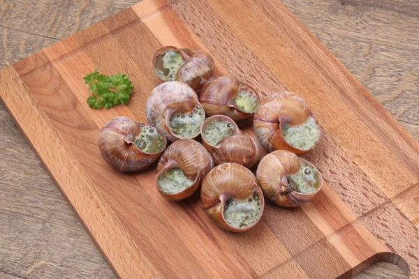 Snails with garlic, butter as french gastronomy gourmet food. — Stock Photo, Image