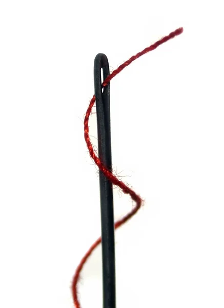 Needle with red thread — Stock Photo, Image