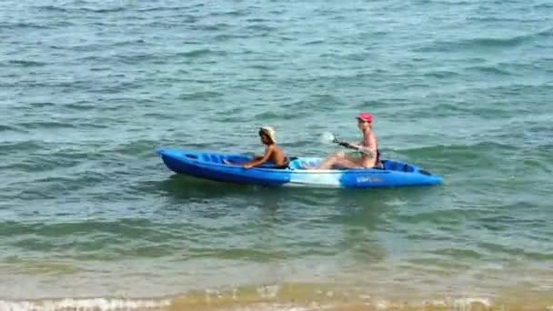 Mother and son kayaking at tropical sea — Stock Video