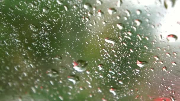 Window with falling raindrops — Stock Video