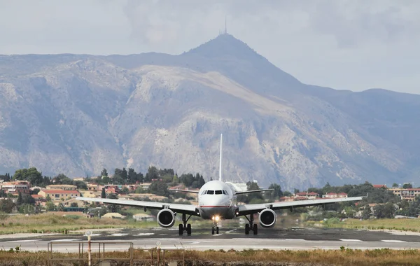 Plane on runway and mountains. Corfu, Greece — Stock Photo, Image