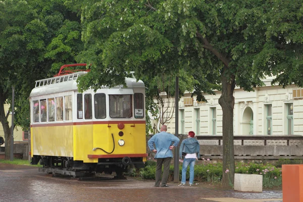 Ancient tram and man with woman, looking at him. Pecs, Hungary — Stock Photo, Image