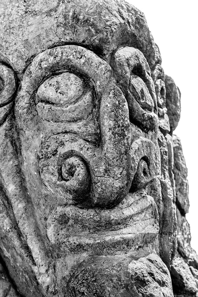 Black and white close-up of a carving of a face in Easter Island — Stock Photo, Image