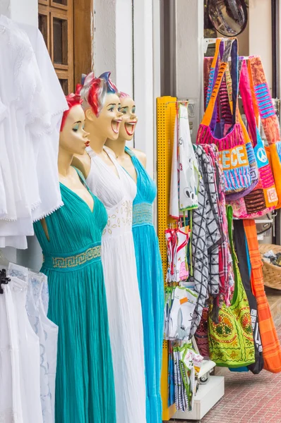 Mannequins in dress in shopfront