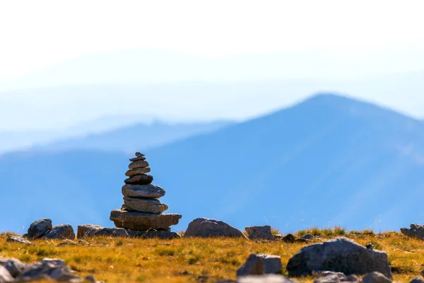 Zen balanced stones stack in high mountains. Scenic mountain view