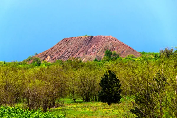 View of slag heaps of iron ore quarry. Mining industry.