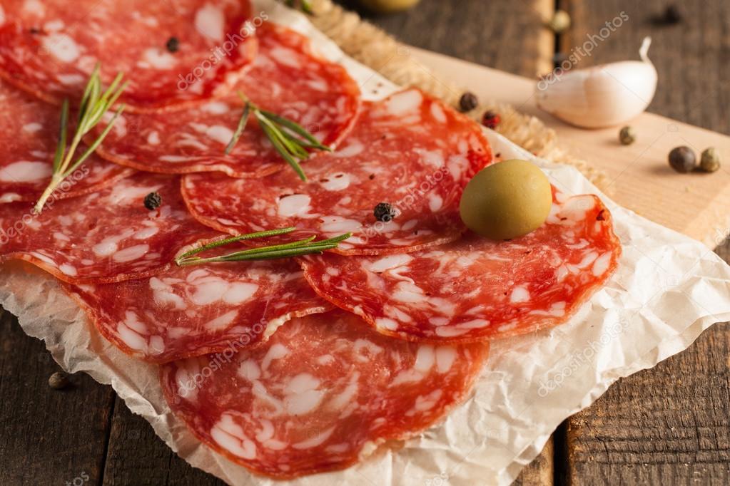 Chorizo sausage and salami, thin cut. spanish salami on the wood