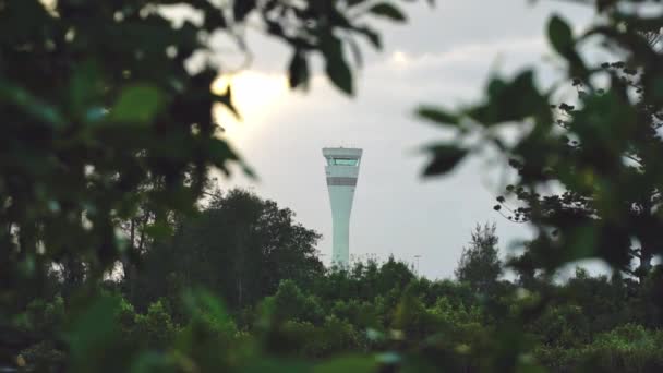 Air Traffic Control tower viewed through lush green vegetation. Brisbane, Queensland, Australia 12 21 2020 — Αρχείο Βίντεο