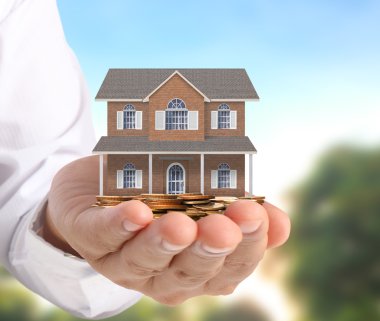ev sahipliği temsil eden holding evi 