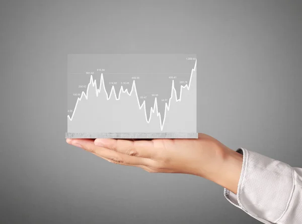 Stock financial graph in hand — Stock Photo, Image