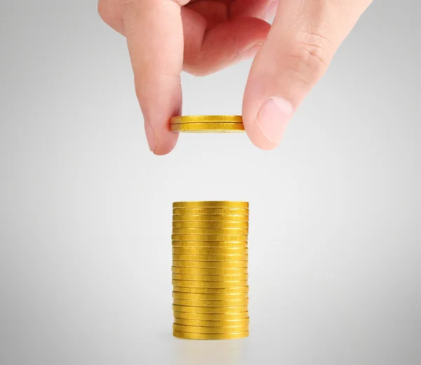 Hand human hand putting coin to mone — Stock Photo, Image