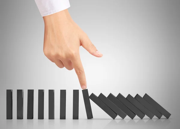 Hand stop  dominoes continuous toppled — Stock Photo, Image