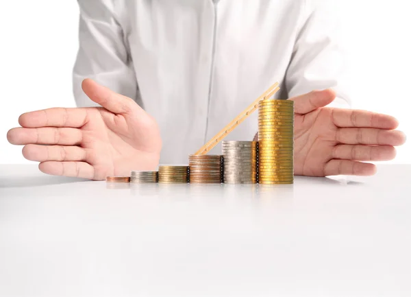 Coin to money in human hand — Stock Photo, Image