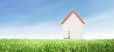 Akşamları çayırdaki otlu model ev.