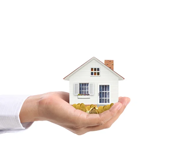 Holding house and coins — Stock Photo, Image