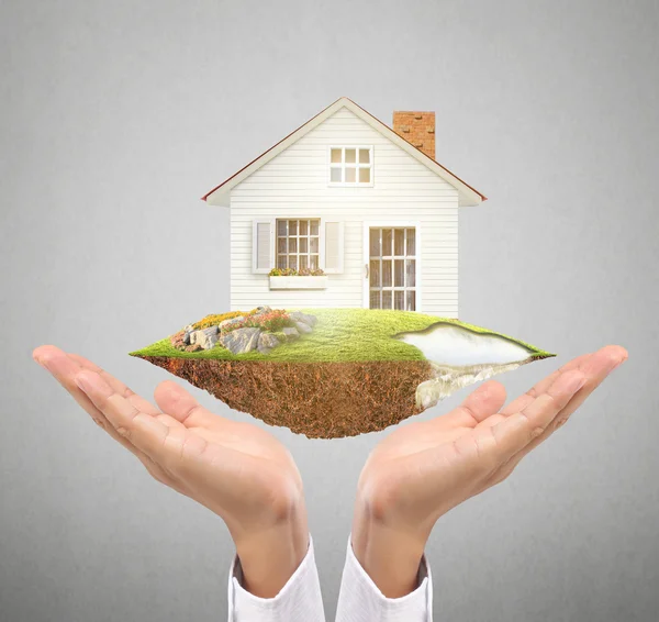 Holding house representing home ownership — Stock Photo, Image