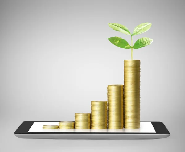 Tablet  with business graph and golden coin — Stock Photo, Image