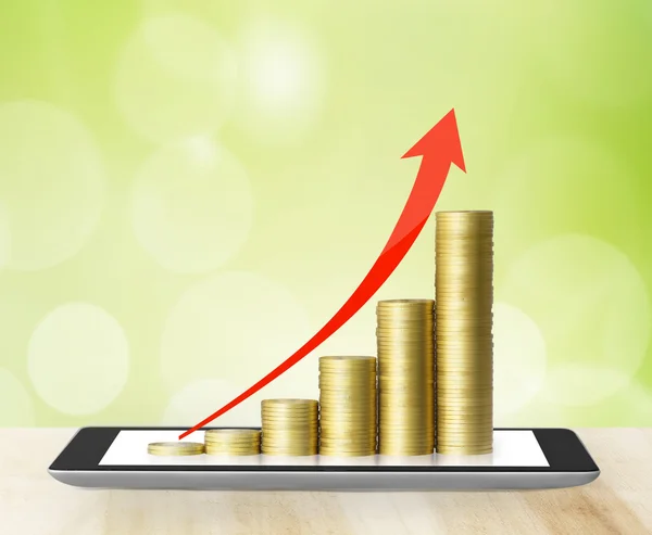 Tablet  with business graph and golden coin — Stock Photo, Image