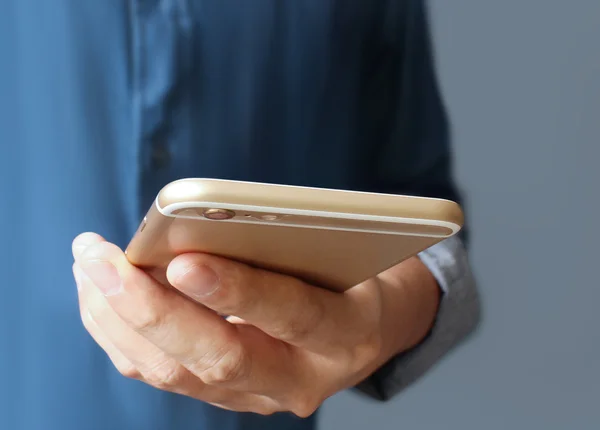 Modern mobile phone in hand — Stock Photo, Image