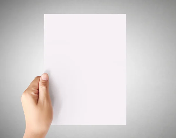 Segurando papel A4 branco — Fotografia de Stock