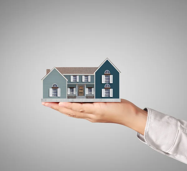 Holding house representing home ownership — Stock Photo, Image