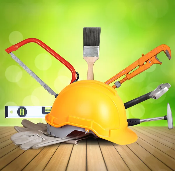 Yellow helmet plastic safety and tools — Stock Photo, Image