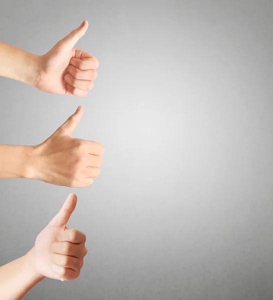 Lidské ruce ukazují palce — Stock fotografie