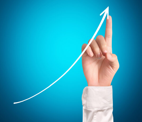 Businessman Touching a Graph