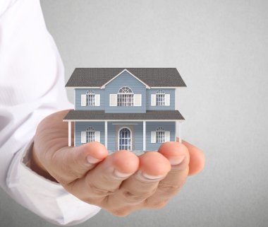 ev sahipliği temsil eden holding evi 