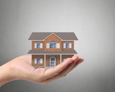 ev sahipliği temsil eden holding evi 
