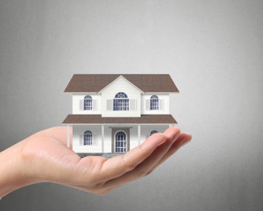 ev sahipliği temsil eden holding evi 
