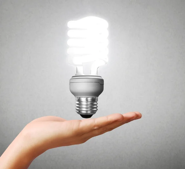 Light bulb idea in the hand — Stock Photo, Image