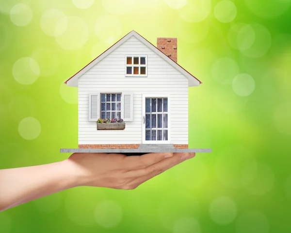 Holding home model, loan concept — Stock Photo, Image