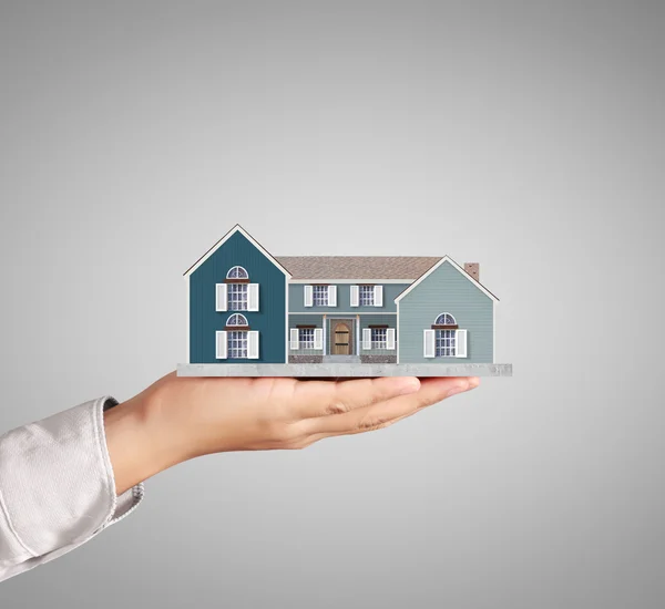 Holding home model, loan concept — Stock Photo, Image
