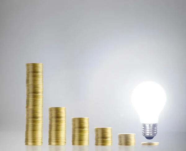 Bulb With Stack Of Coins — Stock Photo, Image