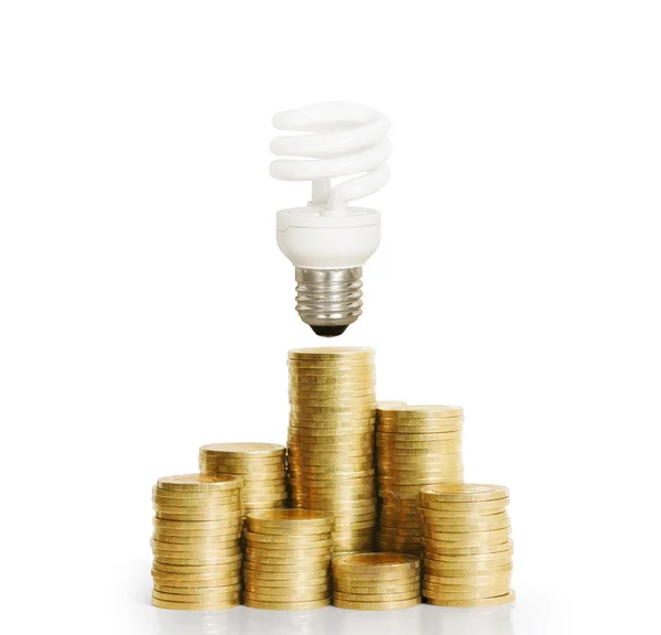 Bola lampu dengan Stack Of Coins — Stok Foto