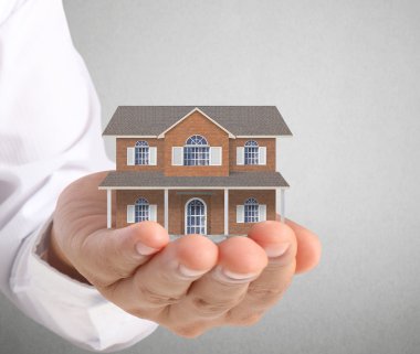 ev sahipliği temsil eden holding evi 