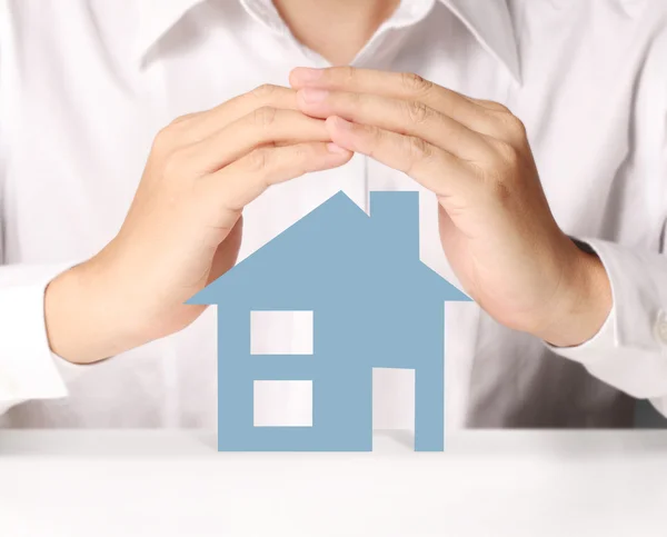 Holding house representing home ownership — Stock Photo, Image