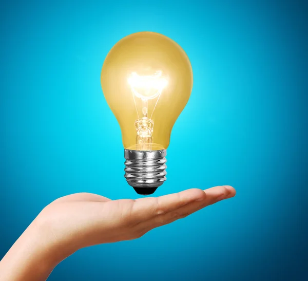 Light bulb idea in the hand — Stock Photo, Image