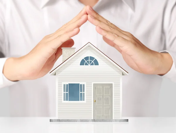 Holding house representing home ownership — Stock Photo, Image