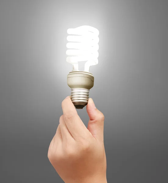Žárovky, žárovka kreativní nápad v ruce — Stock fotografie