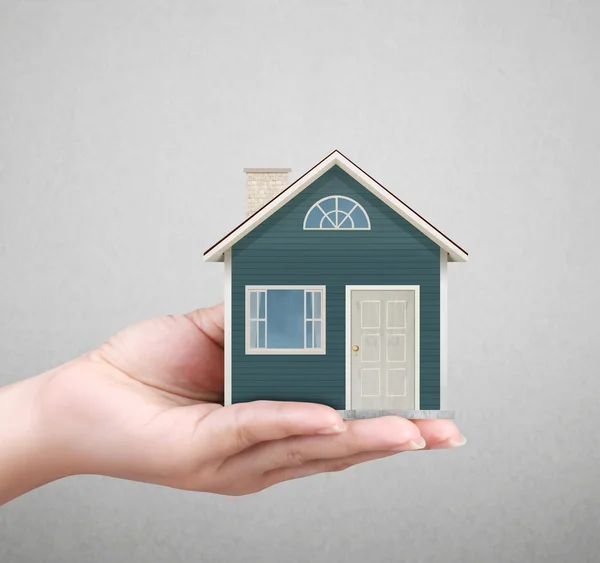 Holding house representing home ownership — Stock Photo, Image