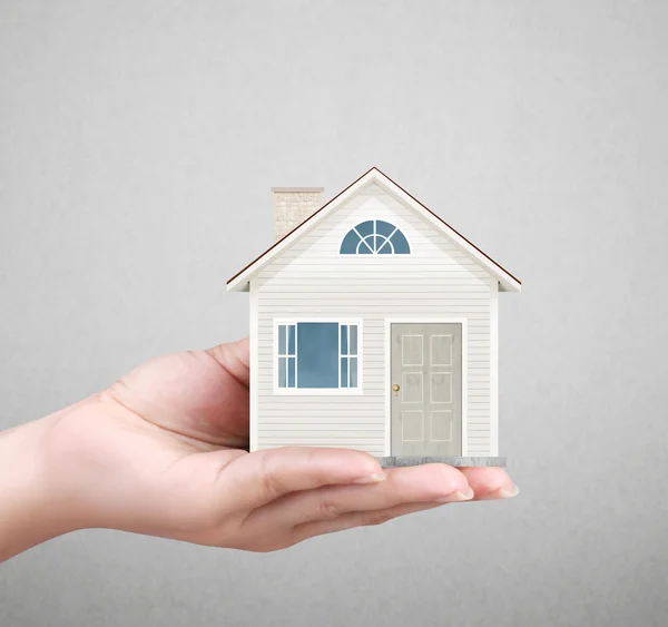 Holding house representing home ownership — Stock Photo, Image