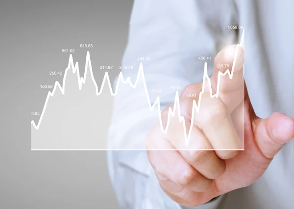 Conceito de nvestment com símbolos gráfico financeiro vindo de mão Imagem De Stock