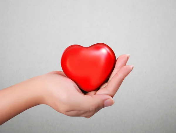 Red heart in hands — Stock Photo, Image