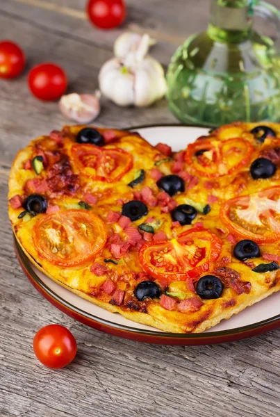hot homemade pizza  heart with cheese, tomatoes, olives