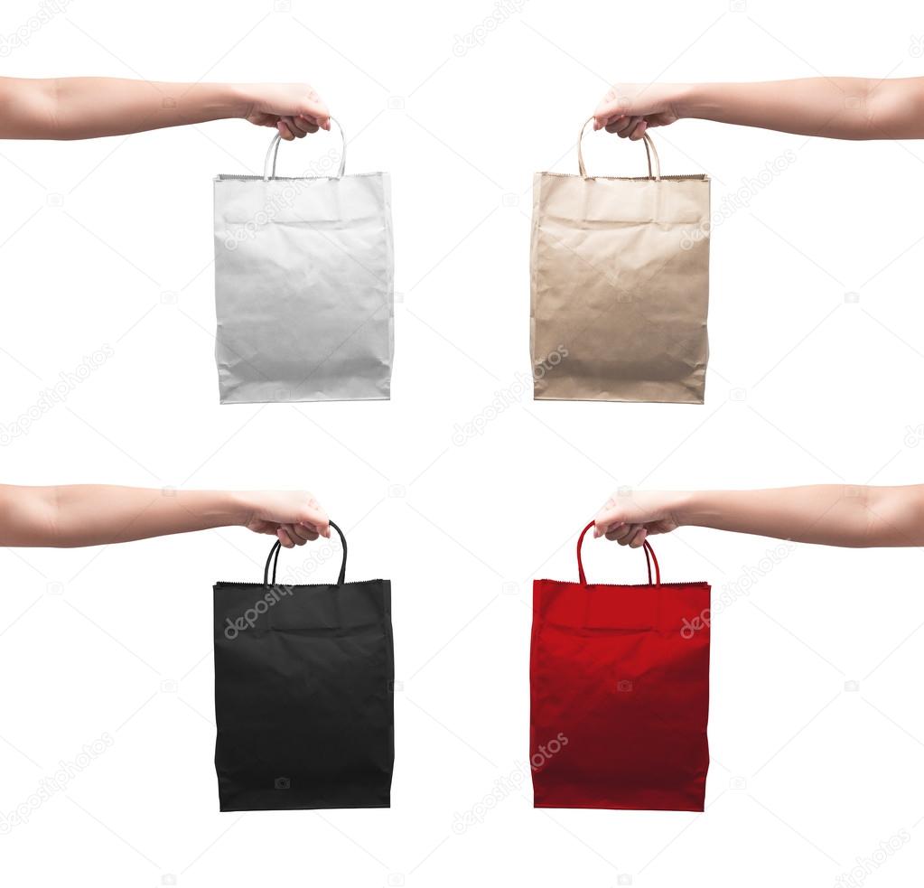 Female hand holding shopping bag 