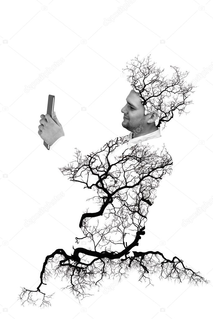 Double exposure portrait of Business man using digital tablet with tree and branch isolated on white