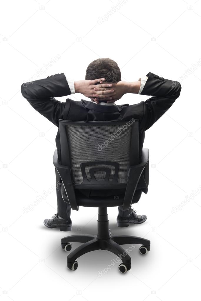 relaxed businessman sitting in office,isolated on white with clipping path