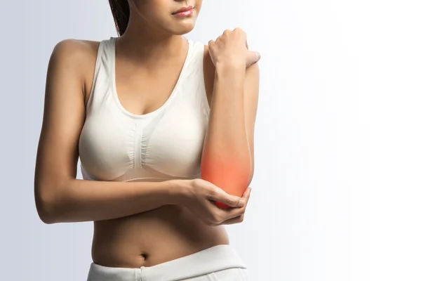 Cuidados de saúde, fitness e medicina - mulher esportiva com dor no cotovelo, em fundo branco com caminho de recorte — Fotografia de Stock